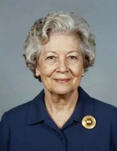The loved one: an old, low-resolution scan of a grandmother with curly grey hair, a navy jacket and a gold brooch.