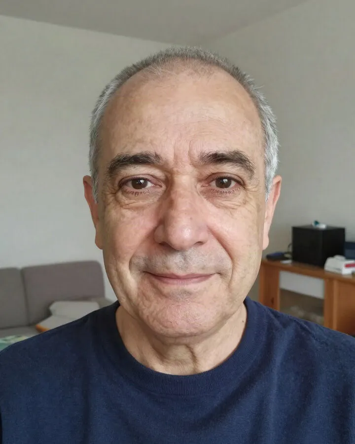 The loved one: a portrait of an older man with short grey hair in a navy sweater.